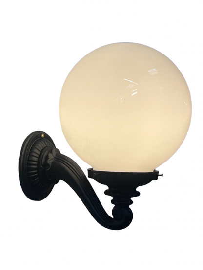 1910s Wall-mounted light fixture with a round glass shade