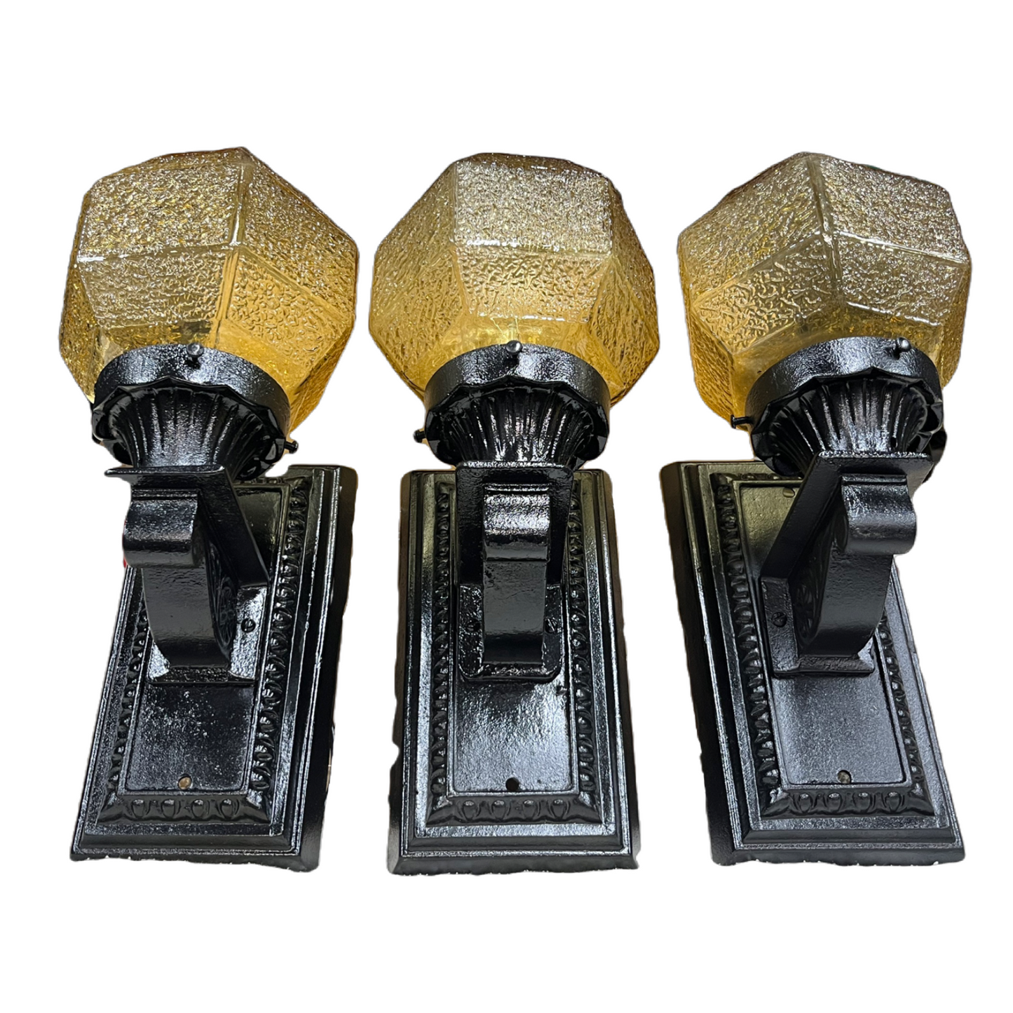 Three Outdoor Lights with Amber Shades