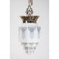 Commercial art deco pendant in polished bronze with black stencil shade