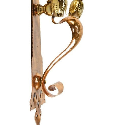 detailed view of art nouveau wall sconces in copper and brass
